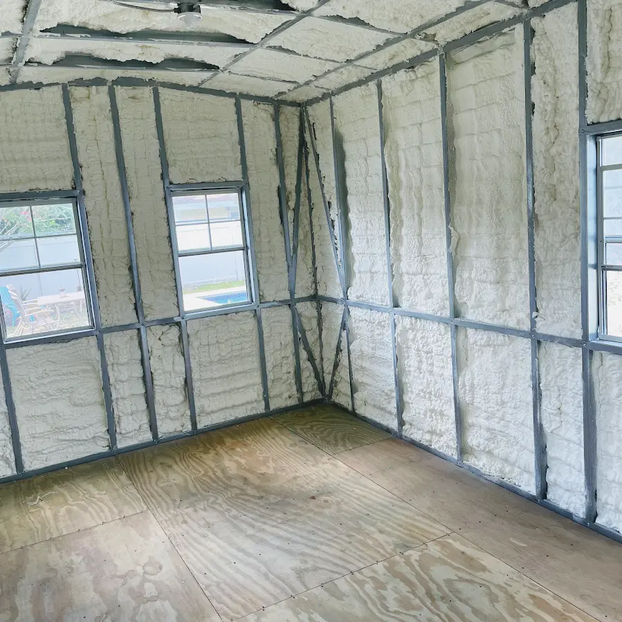 Closed-cell spray foam insulation applied to wall cavities in a residential project in Portsmouth